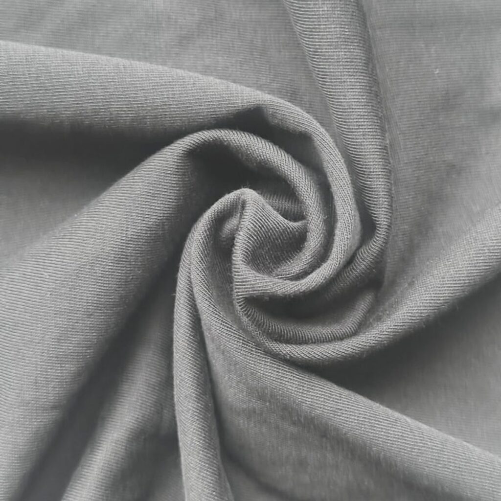 Combed cotton fabric swatch showing the fine even jersey knit