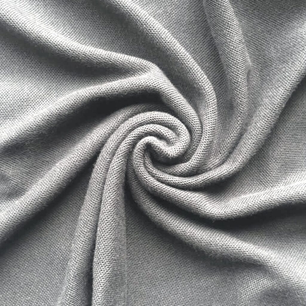 Cotton polyester piqué fabric swatch showing the fine honeycomb cells
